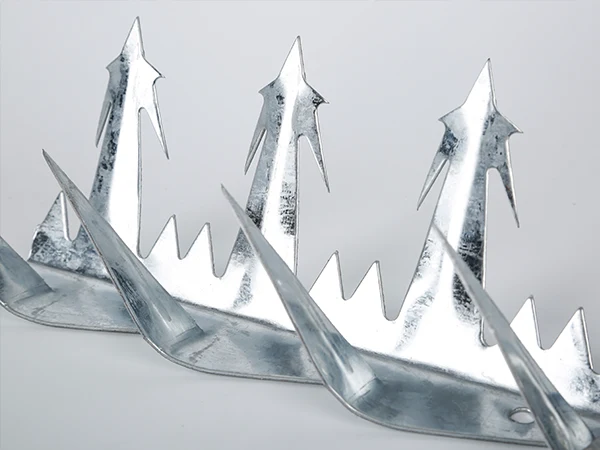 Galvanized wall spikes sheet standing on the white background.