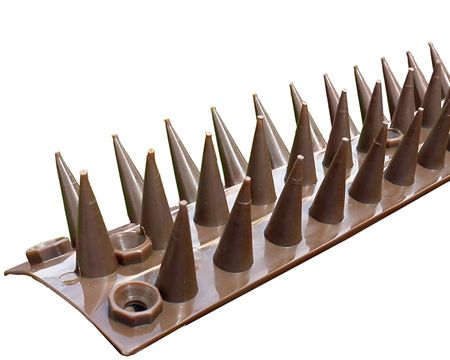 Brown plastic wall spike on the white background.