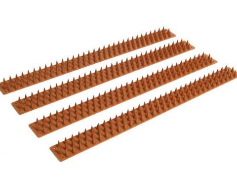 Four lines of orange plastic wall spikes.